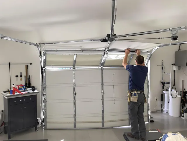 Hudson Garage Door Repair specialist performing precise section replacement on Hudson garage door